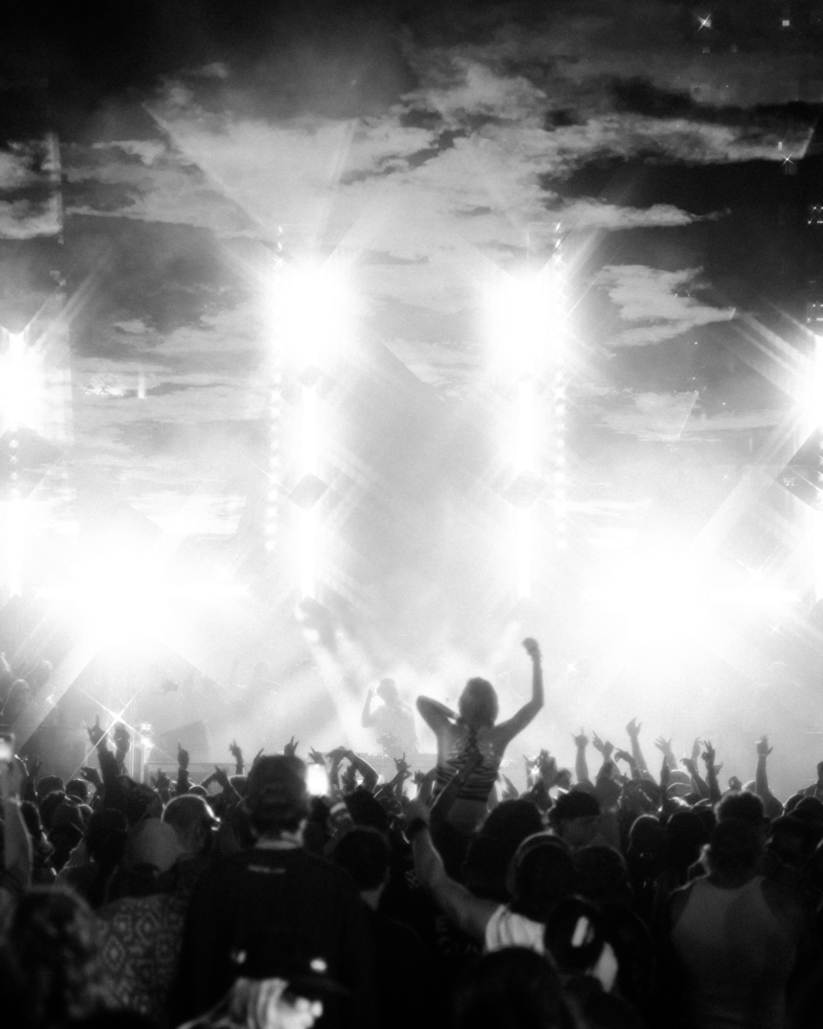 Crowd beneath bright stage lights