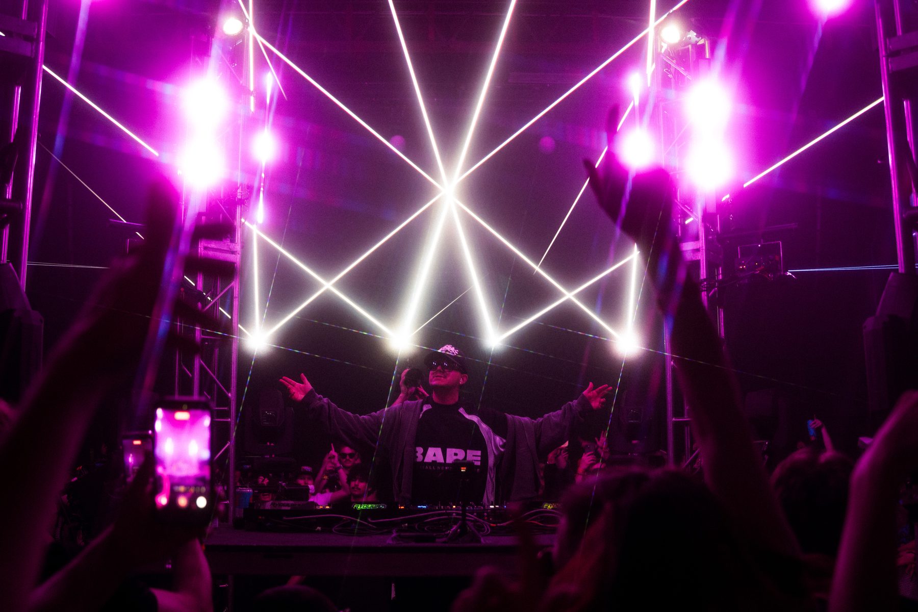 DJ set under purple lasers